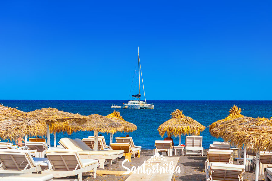 You can rent a catamaran and relax near Perissa Beach, Santorini, Greece
