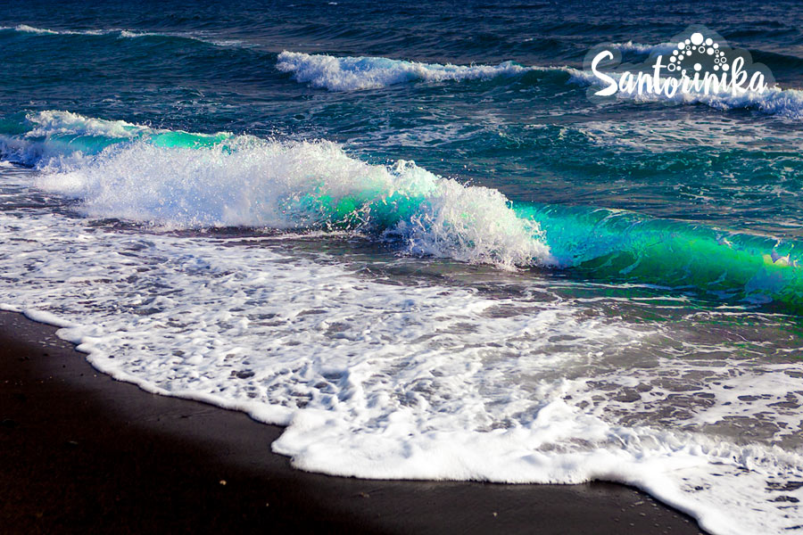 Black sand and turquoise sea at Vlychada beach, Santorini, Greece