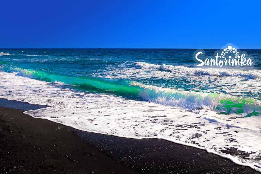 Black sand and turquoise sea at Vlihada beach, Santorini, Greece