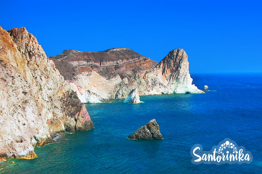 Rocky coast and White Beach cove, Santorini, Greece